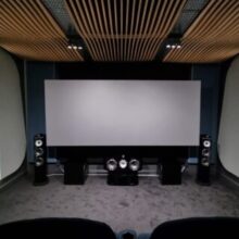homeation B&W cinema room with wave ceiling designed by acoustic worx